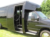 black 25 passenger executive bus, do