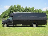 black 25 passenger executive bus, l