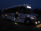 ameritrans freightliner bus with restroom, night